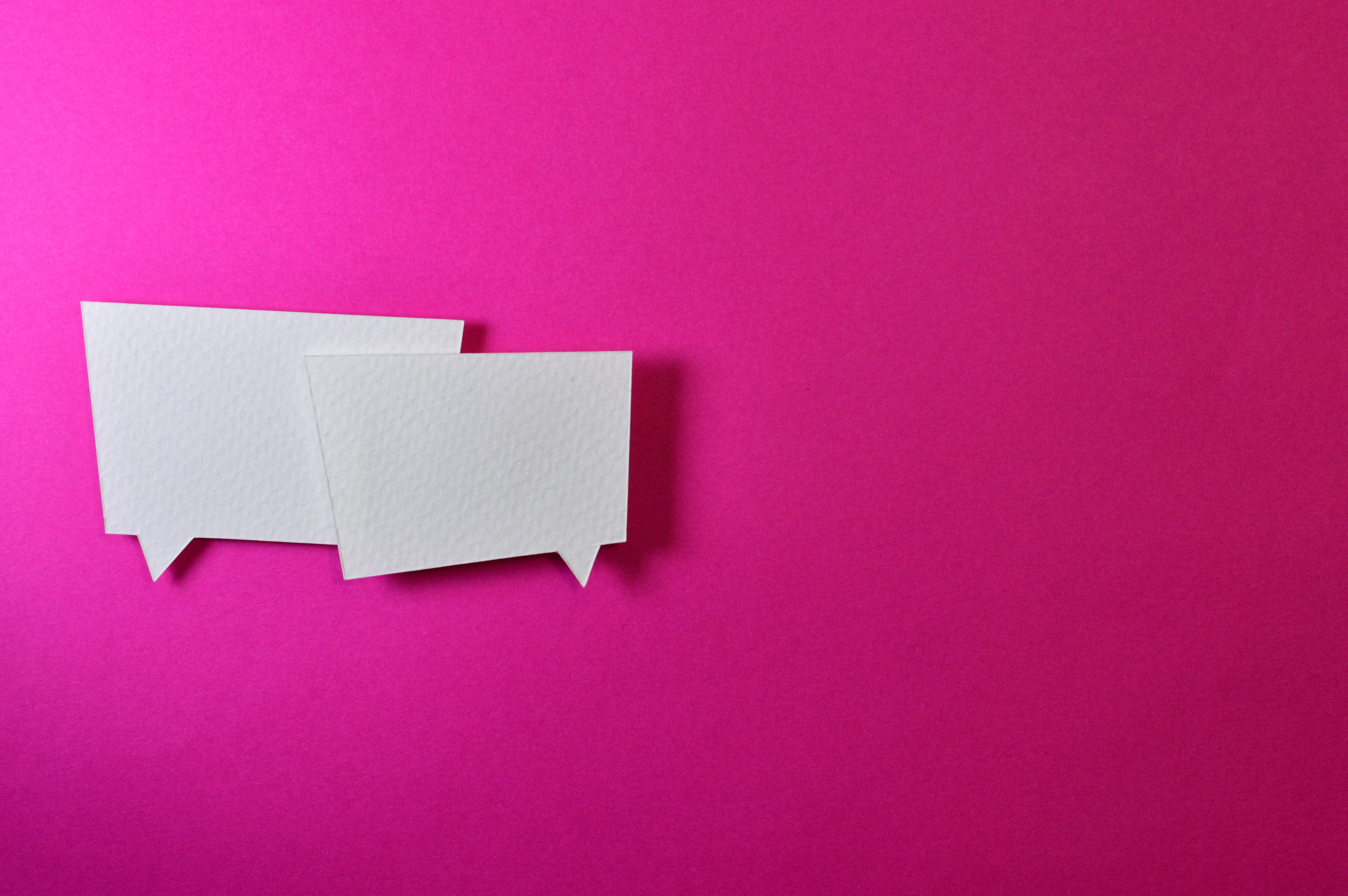 conversation bubbles on pink background