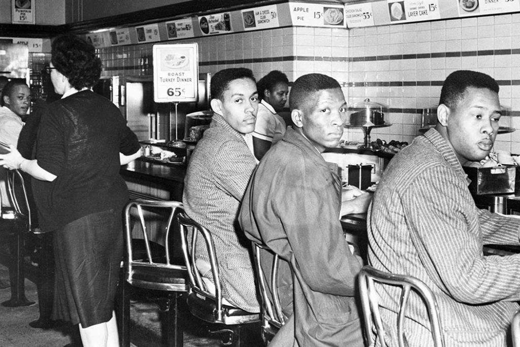 Two black men at the Woolworth's lunch counter sit-in.