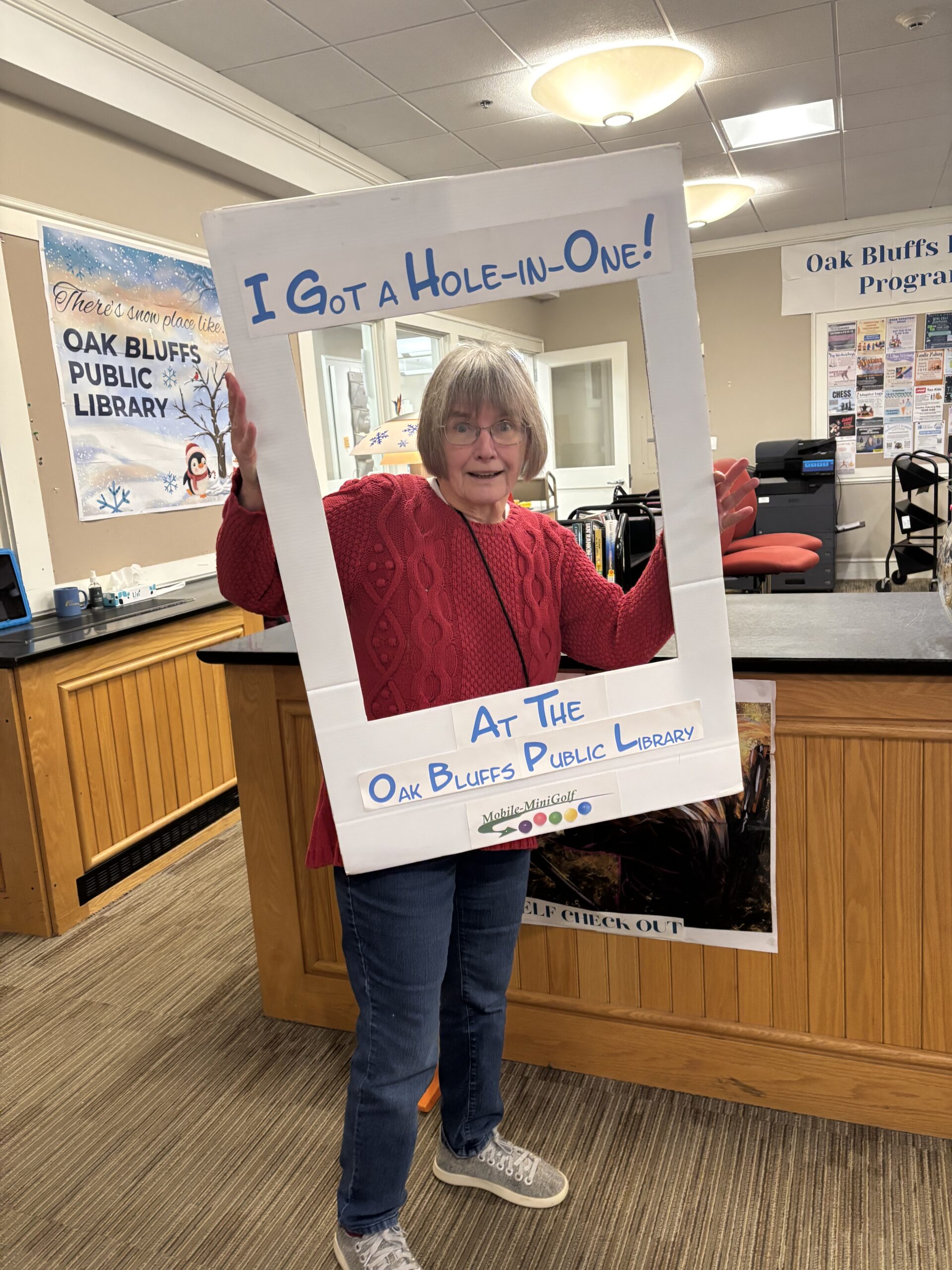 A photo of the LFOB president holding a "I got a hole in one" sign.